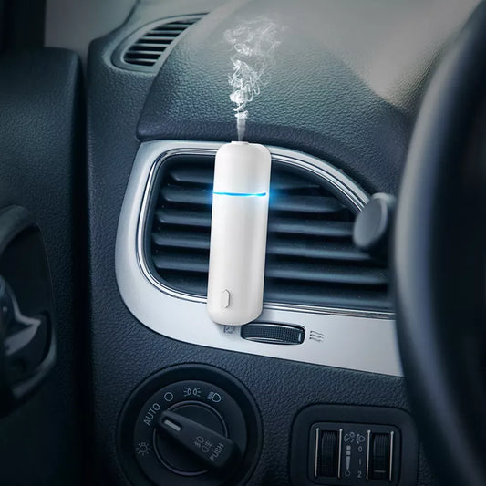 Viaje aromático de lujo: Difusor de perfume para automóvil eléctrico sin agua con clip de ventilación